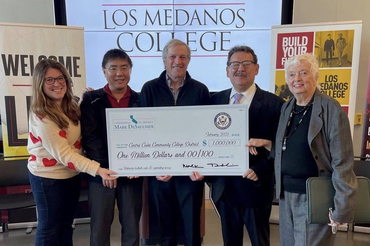 Leaders at Los Medanos College hold a ceremonial one-million-dollar check from Congressman Mark DeSaulnier