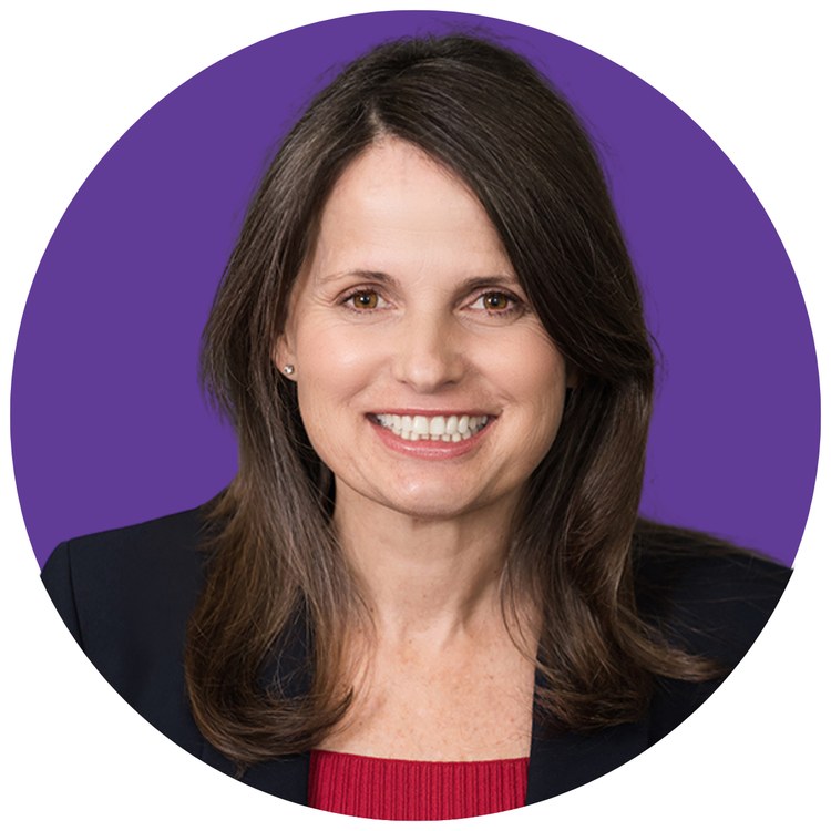 County Superintendent of Schools Lynn Mackey in a purple circle badge