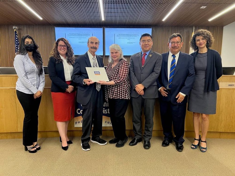 Board members present a commendation at a Contra Costa Community College District board meeting