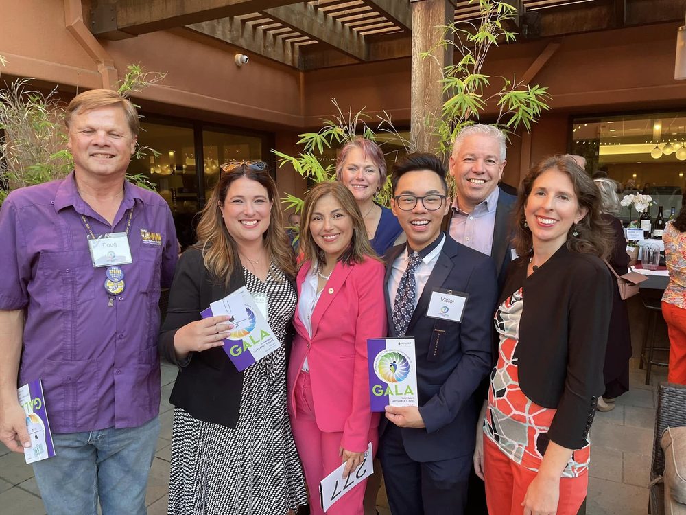 Rebecca with friends and colleagues at a community gala in Contra Costa