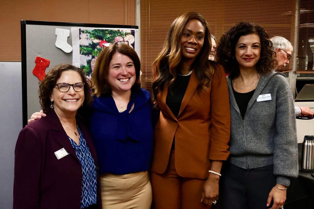 Rebecca with community leaders at a holiday gathering